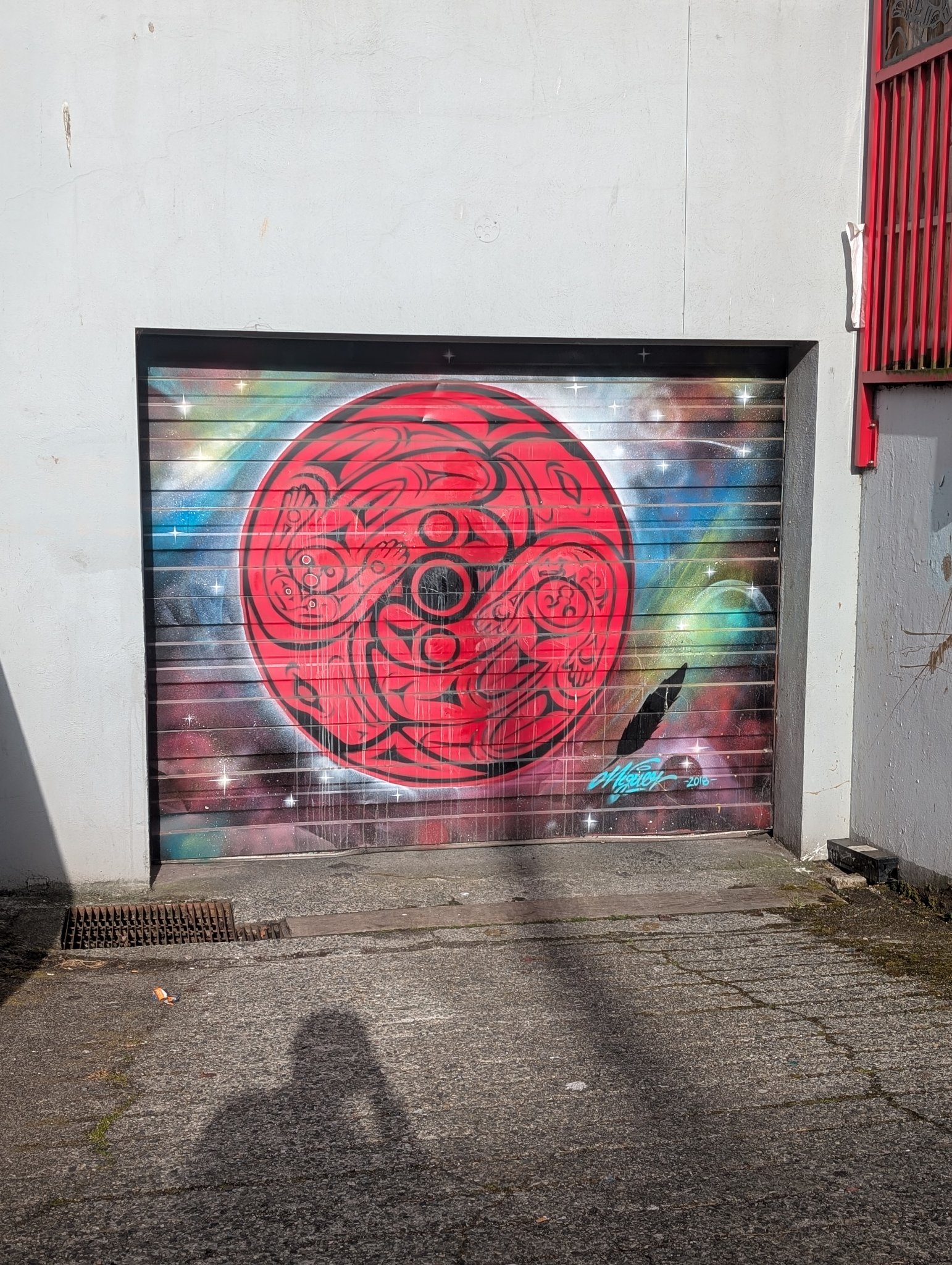 Red circle mural in Vancouver, photographed May 27, 2026